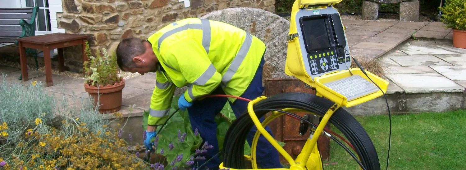 Close-up of damaged underground drain pipe in a garden in Eastleigh
